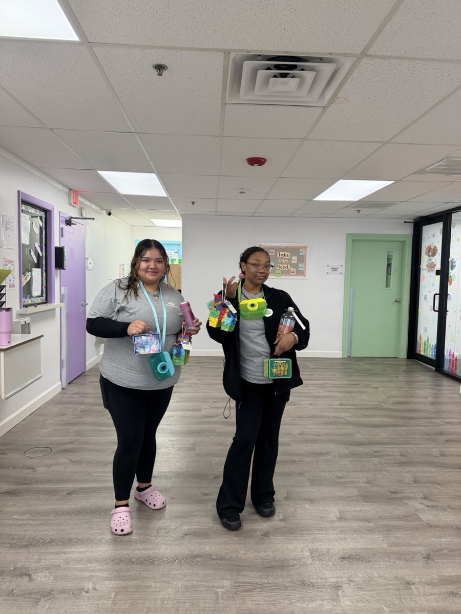 Teachers in the hallway with their gift boxes